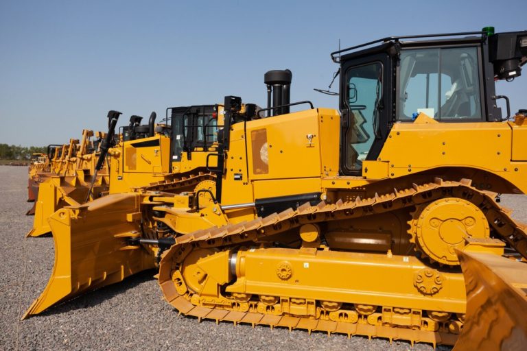 row-of-bulldozers-in-a-construction-site